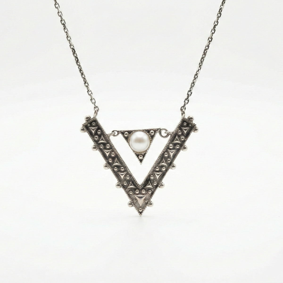 Hand made sterling silver ornamental pendant