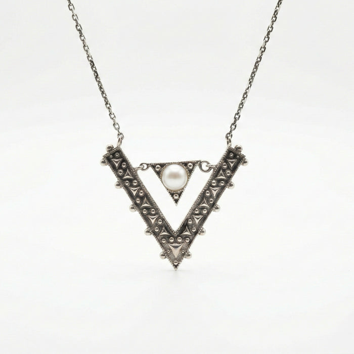 Hand made sterling silver ornamental pendant