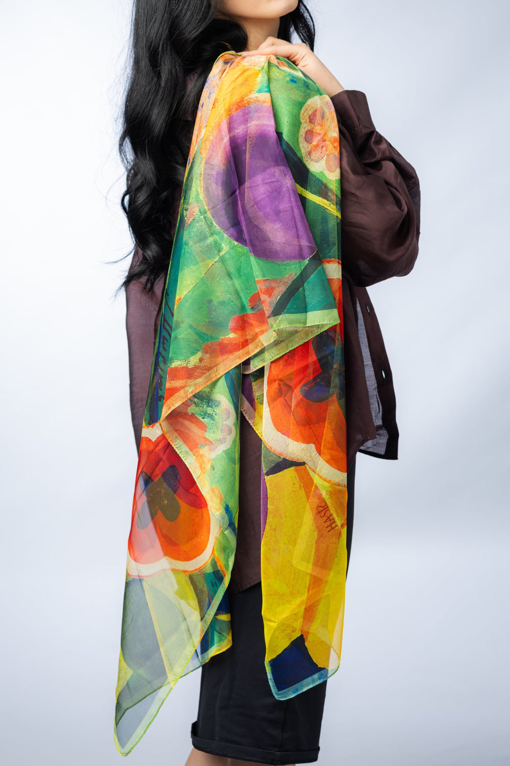 Model holding a silk scarf